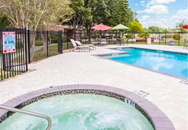 A swimming pool with a fence around it. AI generated content